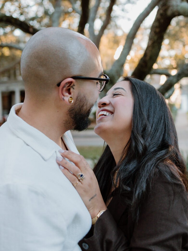 Candid engagement photo of a couple outdoors in the DMV area captured in natural light during a lifestyle session